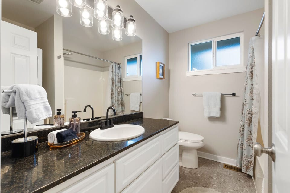 Main Bathroom: Elegant finishes and natural light make this space a retreat for relaxation!