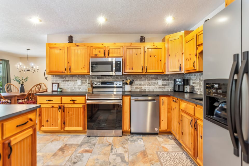 Newly renovated kitchen with granite countertops and dishwasher