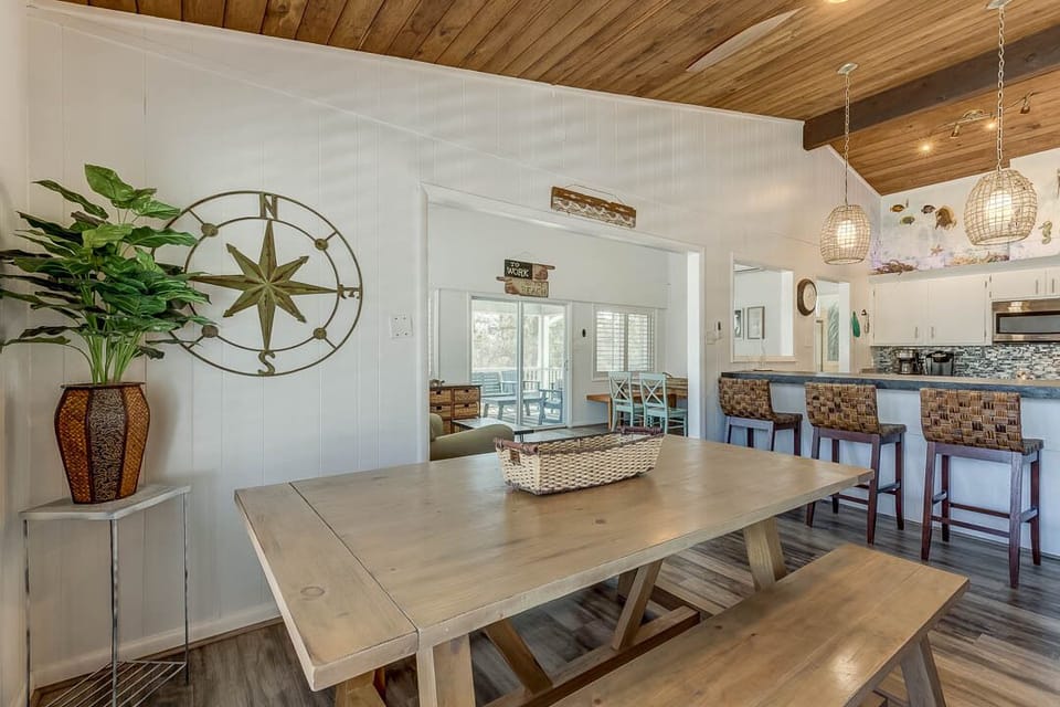 Top-Level Kitchen with Bar (seats 5) and Additional Table (seats 8)