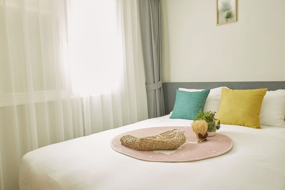 Deluxe Family Twin Room | Minibar, desk, laptop workspace, blackout drapes