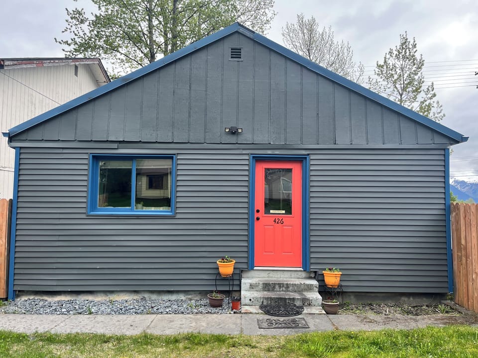 This is what the front of the house looks like. Enter through the orange door.
