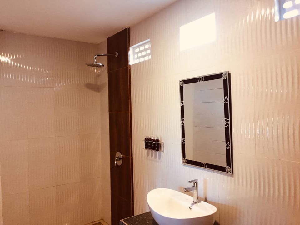 Shower, rainfall showerhead, towels, soap