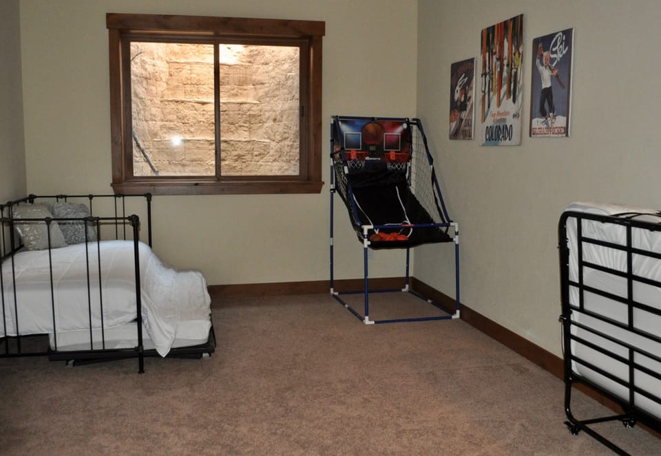 Basement living area with 3 additional twin beds
