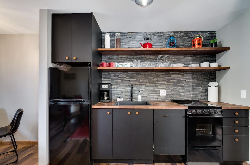Full kitchen with hidden dishwasher and microwave