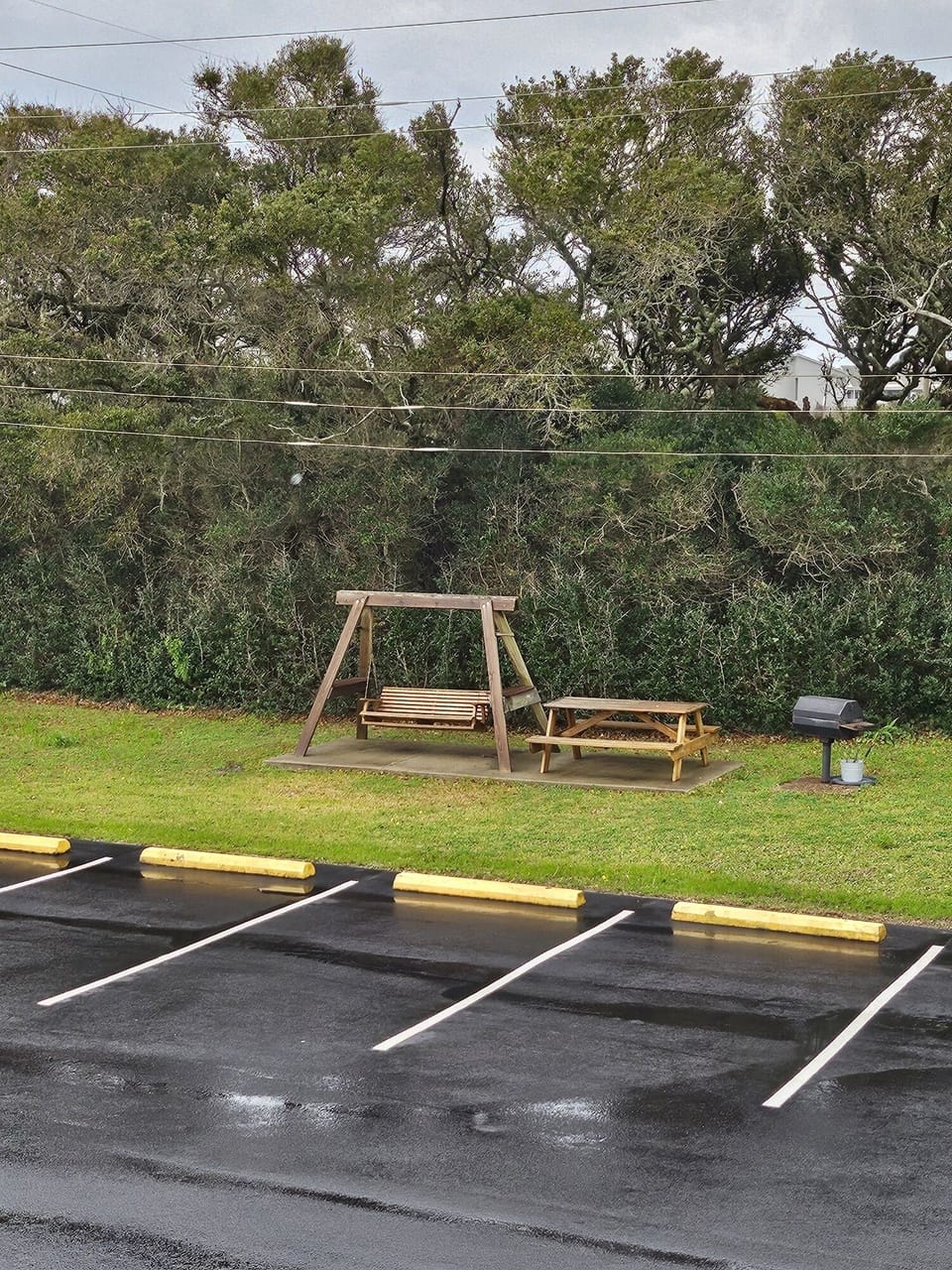 A swing to sit in while you cook on one of the grills