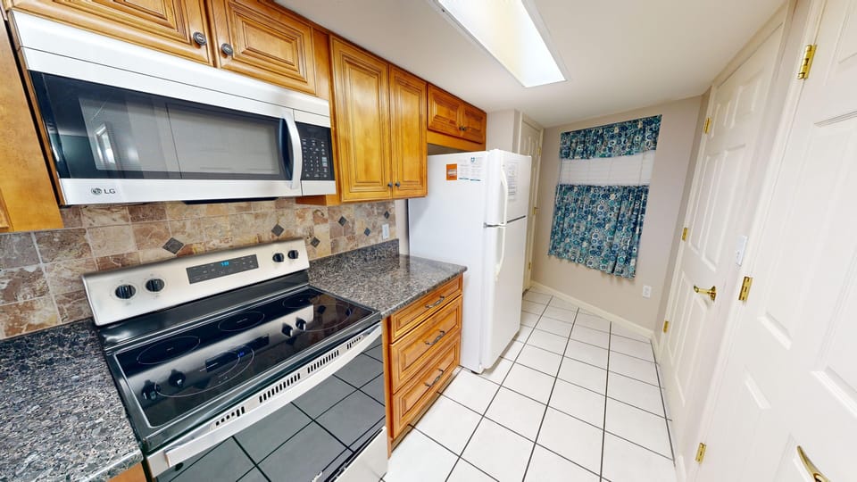Condo, 2 Bedrooms | Private kitchen | Fridge, coffee/tea maker, toaster