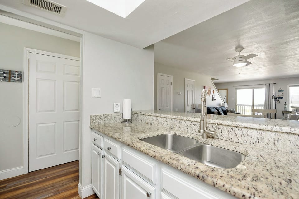 Your bright kitchen features granite countertops and opens to the living area, perfect for morning coffee prep.