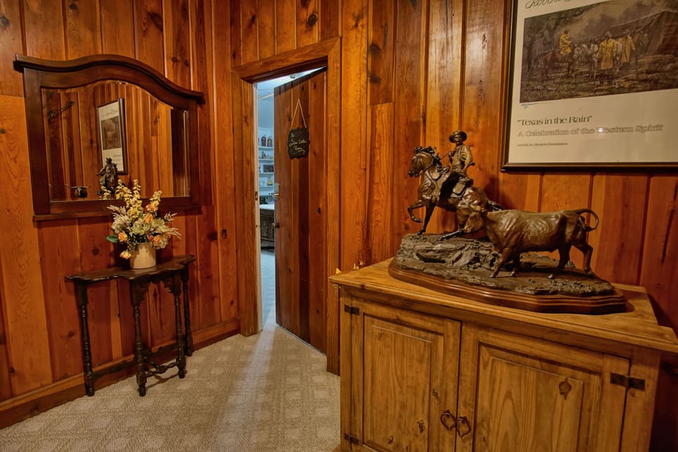 hallway to Silver Dollar room, Longhorn room, and Family Suite in basement
