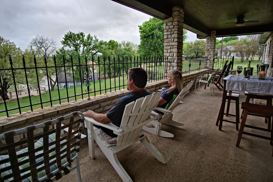Covered front porch off of living room  and upper yard.