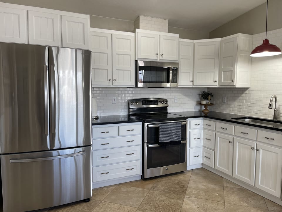 Beautiful custom kitchen with a double oven. Brand new fridge and microwave. 