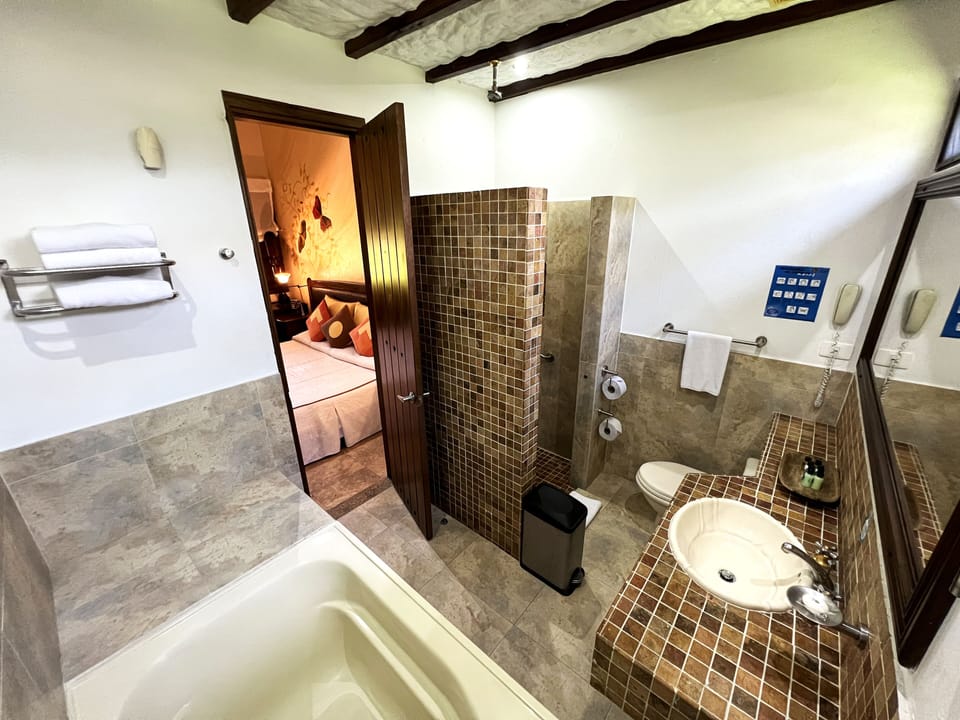 Superior Quadruple Room | Bathroom | Separate tub and shower, deep soaking tub, hydromassage showerhead
