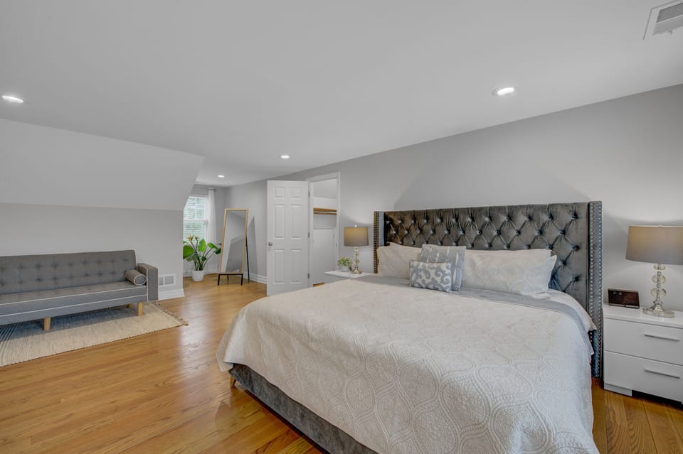 King bed is full of king-sized pillows for a comfortable night's rest. 