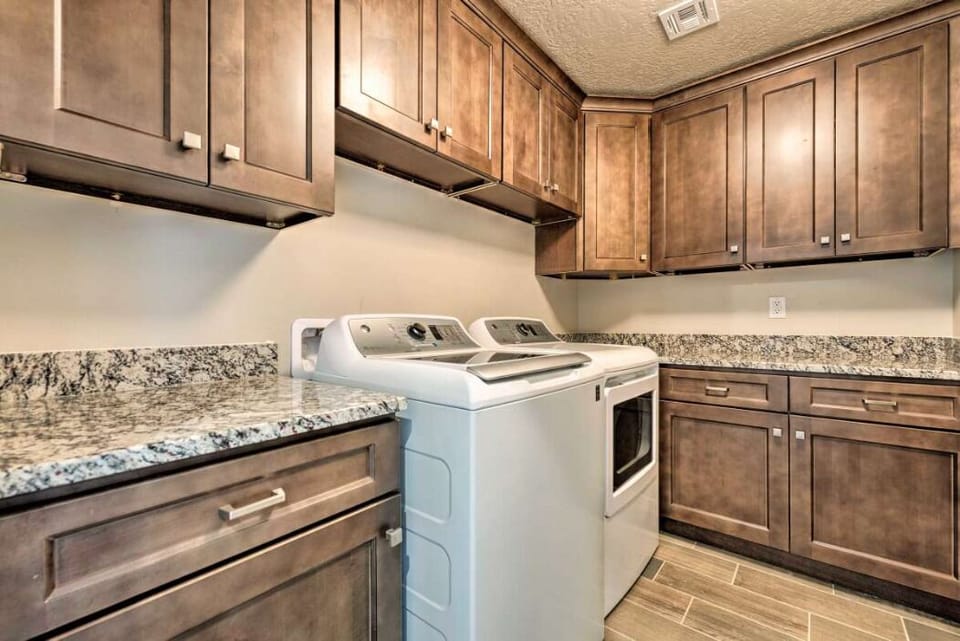 Just in case you get the urge, beautiful laundry room with oversized machines.