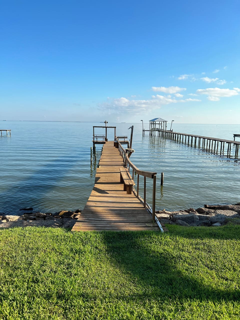 View as you walk on the pier, rail &  Fish cleaning station on the right 