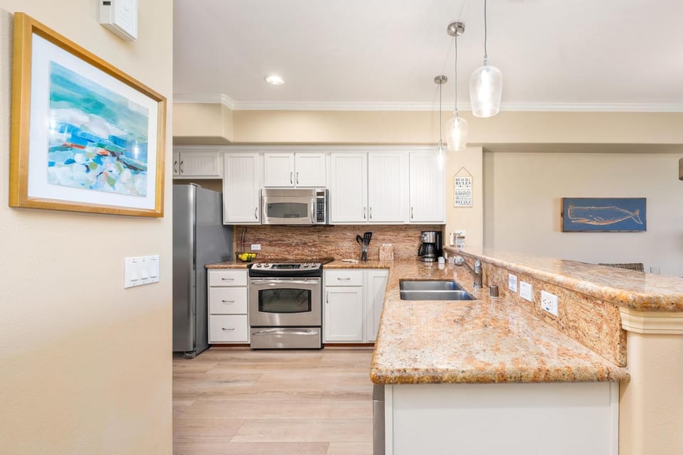Fully equipped kitchen with granite counters and stainless steel appliances
