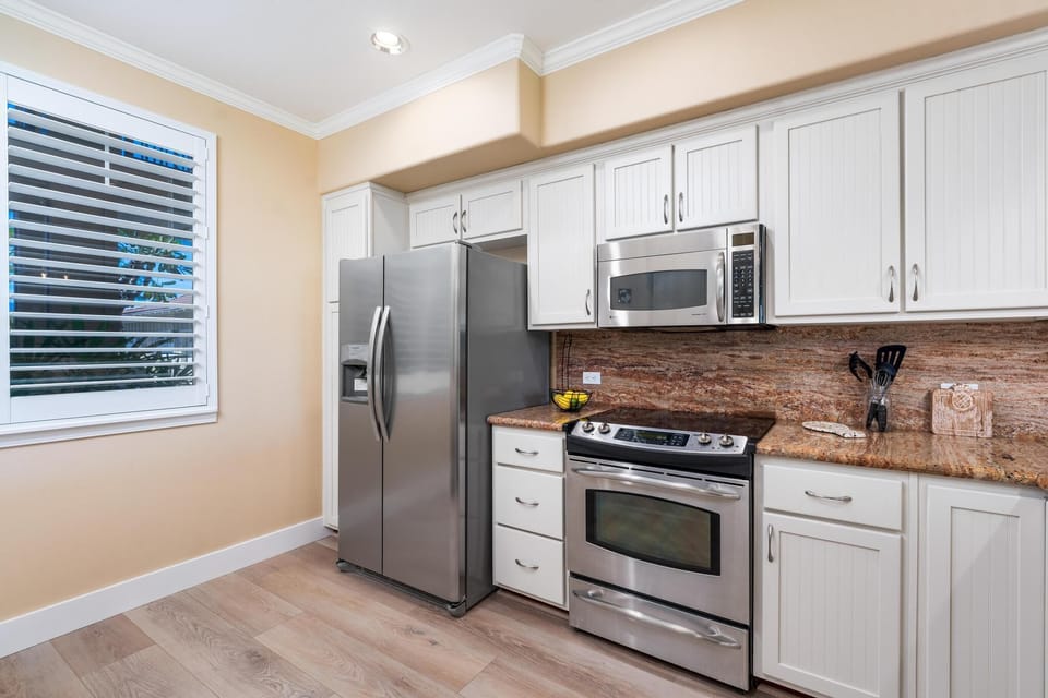Fully equipped kitchen with granite counters and stainless steel appliances