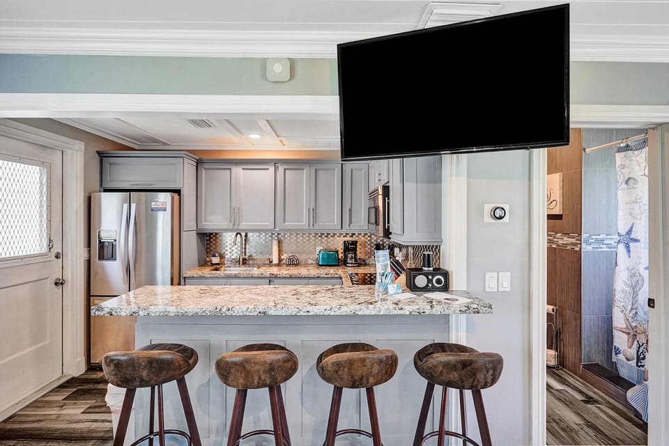 Flat screen television mounted on wall. Streaming services only.
