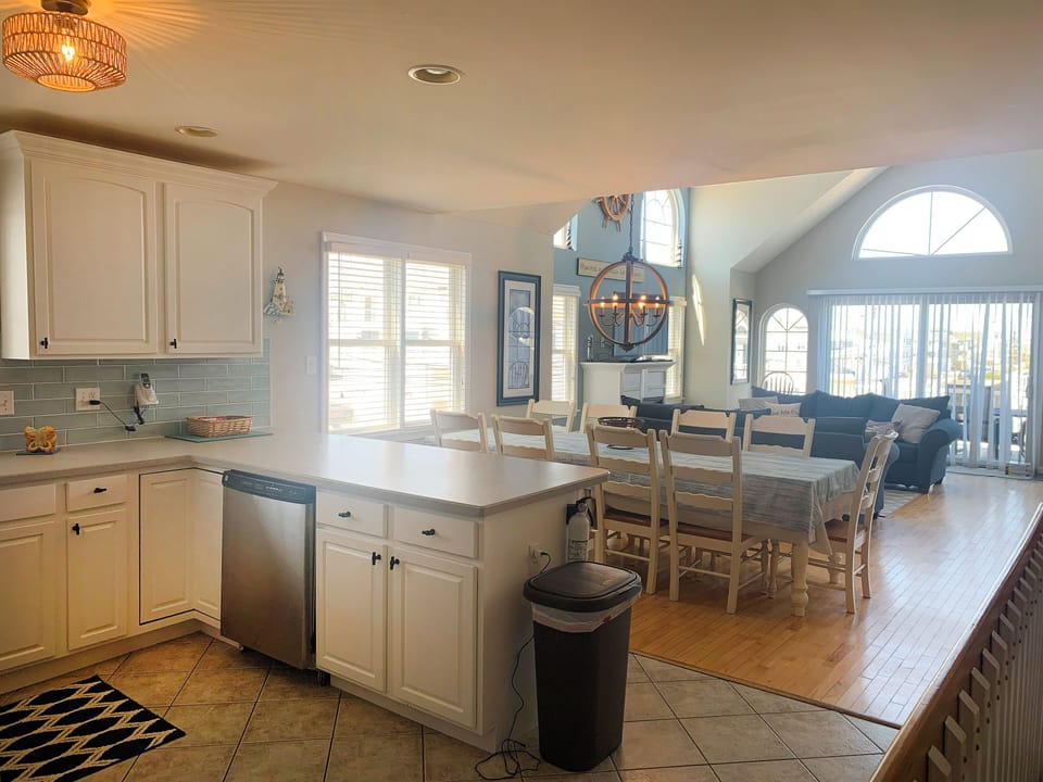 Updated kitchen with table for 10 and open floor plan. 