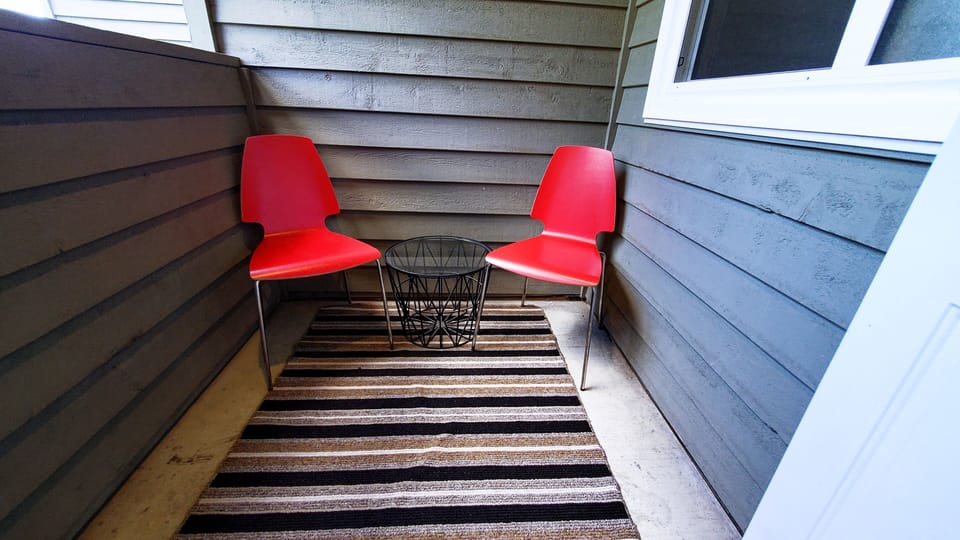 A small outdoor seating area is the perfect place to take in the views