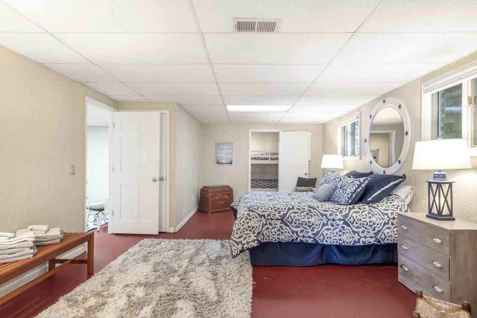Lower level bedroom with Queen bed and attached bunk room with 2 single bunks.