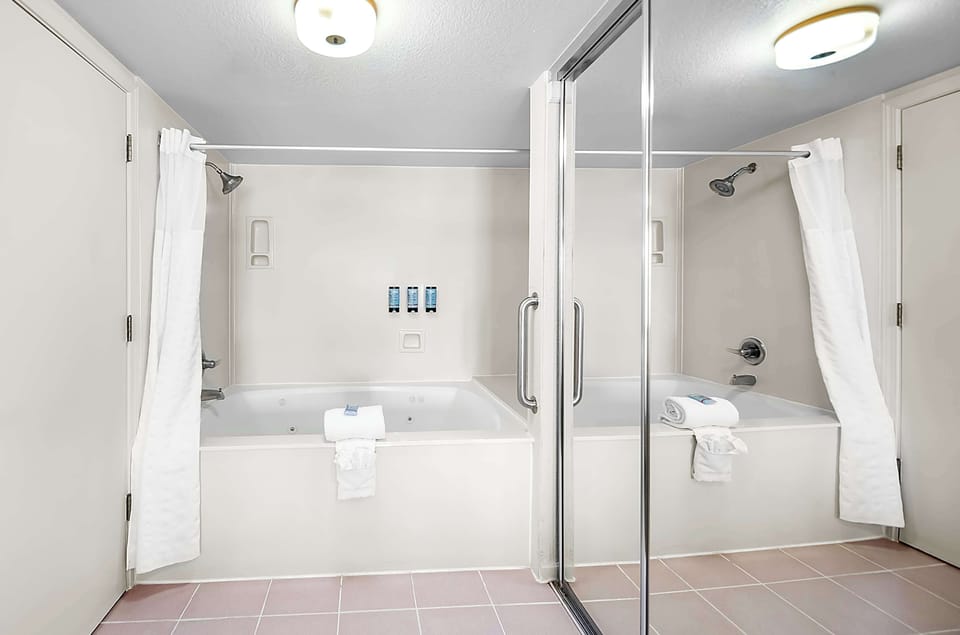 Standard Room, 1 King Bed, Non Smoking, Jetted Tub | Bathroom | Combined shower/tub, hair dryer, towels, soap