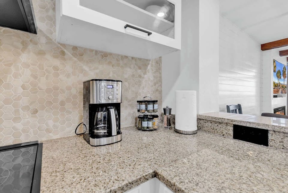 The kitchen comes equipped with 15 cup coffee brewer, electric tea pot, knife set, spice rack.