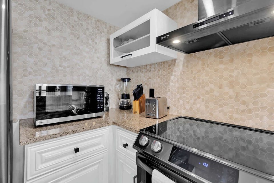 The kitchen comes equipped with 15 cup coffee brewer, electric tea pot, knife set, toaster, blender, spice rack.