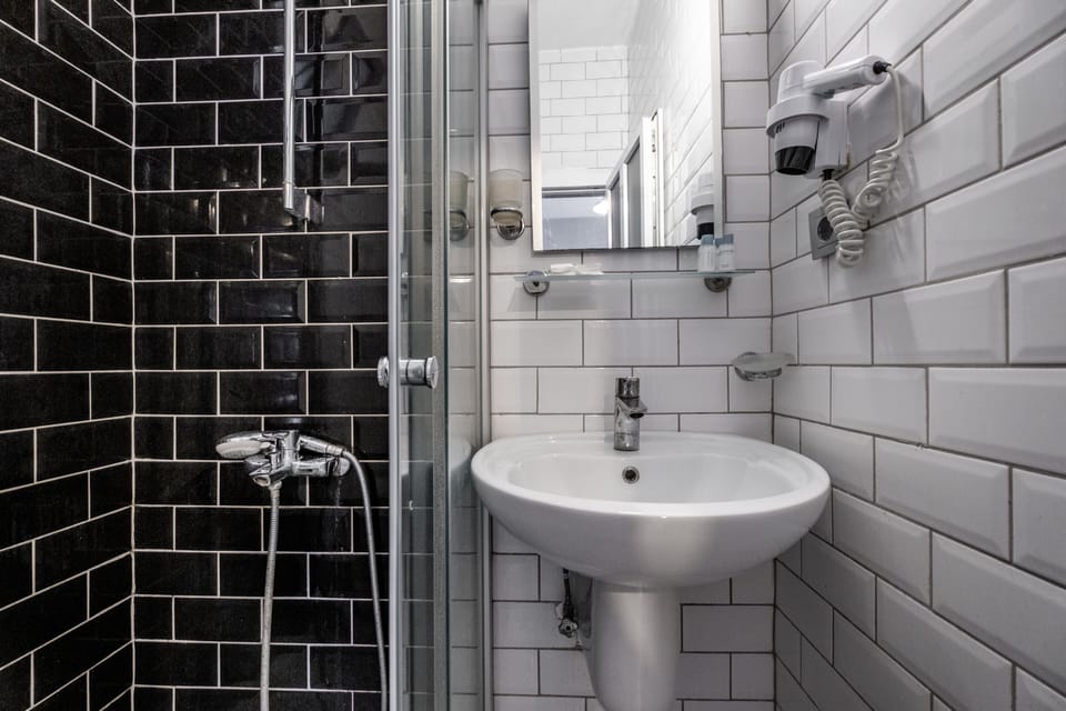 Shower, free toiletries, hair dryer, slippers