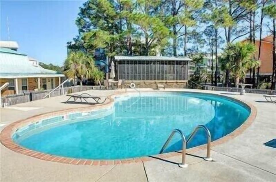 Surf club pool looks directly at the beach! Outdoor showers and sun chairs!
