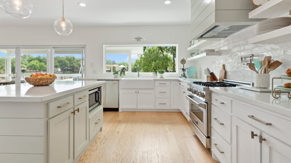 Even doing dishes is enjoyable with this view! Large farmhouse sink/gas range and microwave