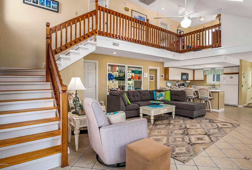 Stairs going up to the 2nd level with a loft overlooking the first level