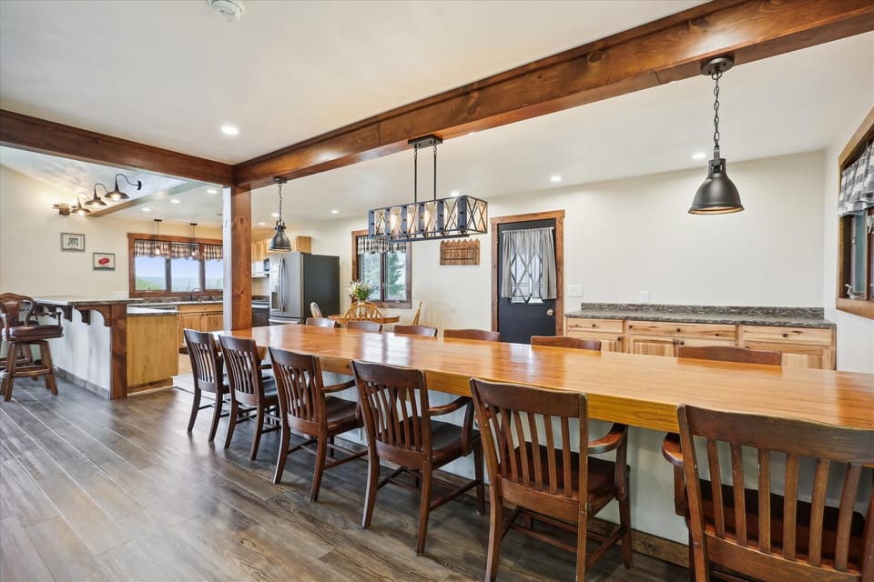 Large, custom made dining table, with seating for up to 12