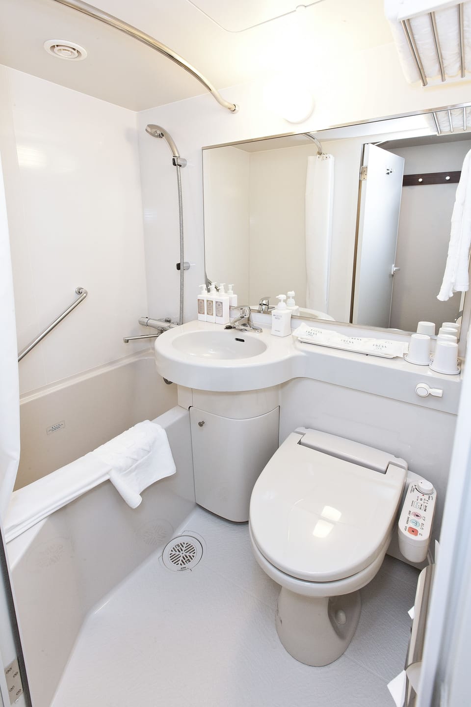 Combined shower/tub, free toiletries, hair dryer, slippers