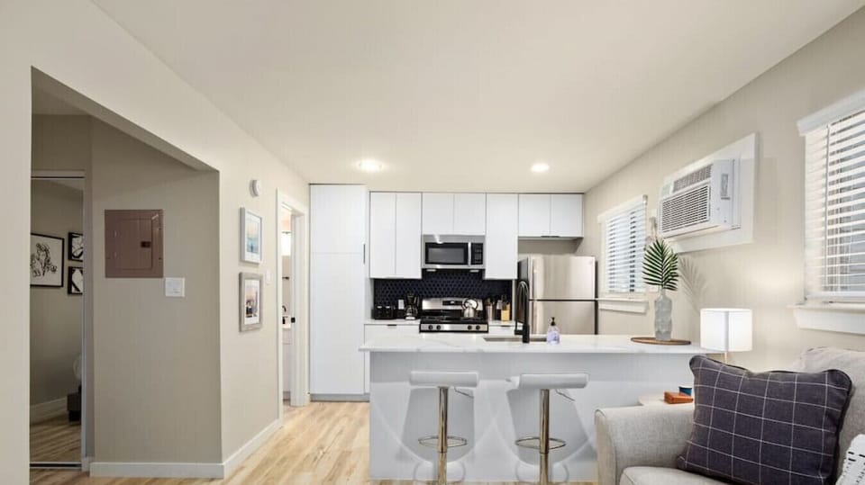 Living room and kitchen with bar seating