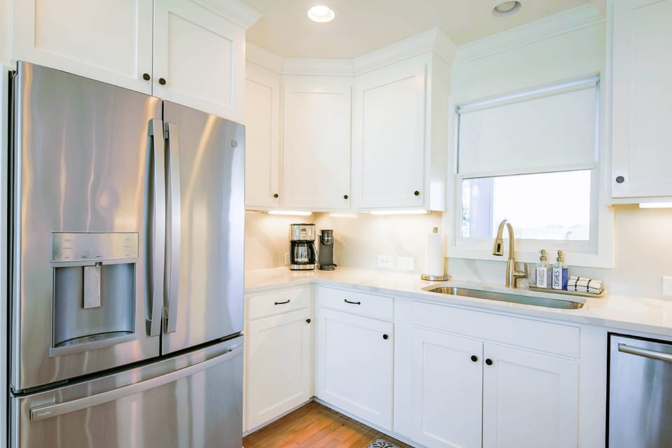 The kitchen has a dishwasher, refrigerator, garbage disposal, Keurig and drip coffee maker.