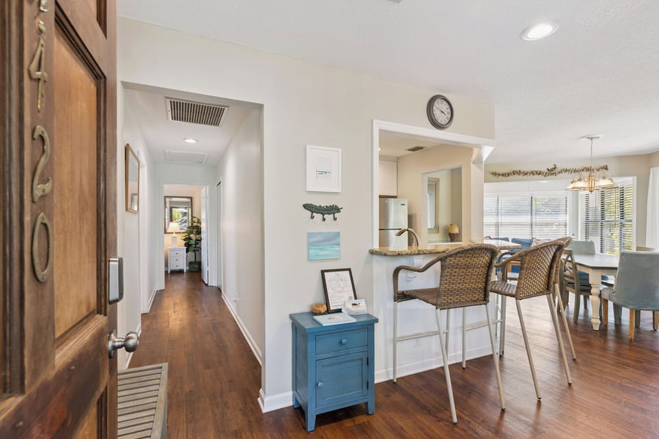 Step inside to discover an open, inviting space where warm hardwood floors connect your kitchen, dining area, and beyond—perfect for gathering, cooking, and relaxing together.