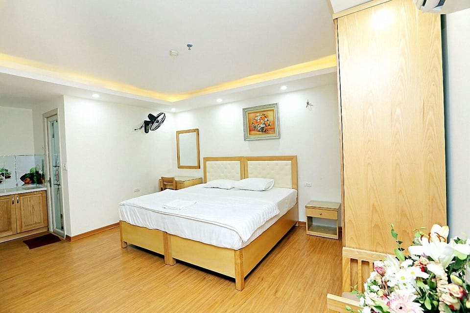 Deluxe Double Room Single Use | Minibar, desk, laptop workspace, blackout drapes