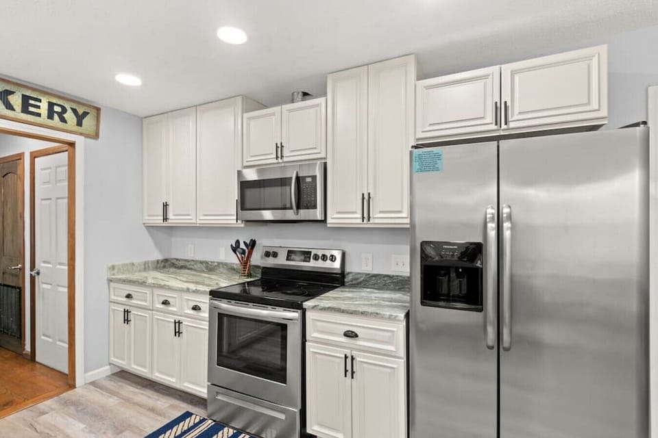 Fully-stocked and well-appointed kitchen with custom granite & cabinets, dining room, and more. Located on 2nd floor (main floor).