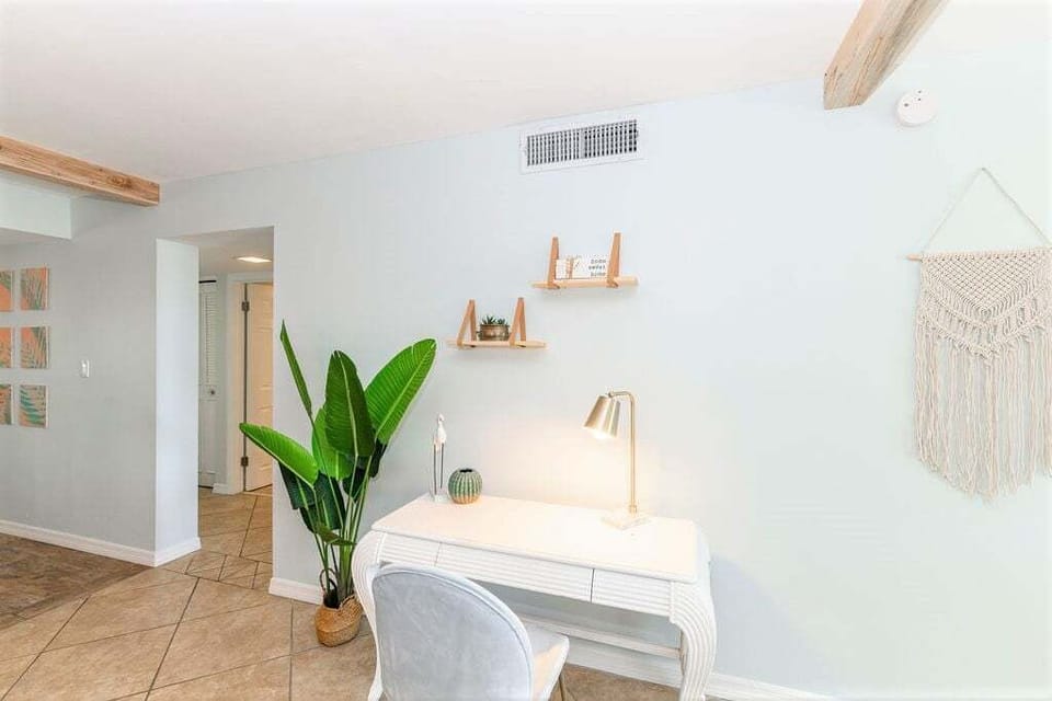 Stay productive in a cozy workspace with a sleek desk and natural light
