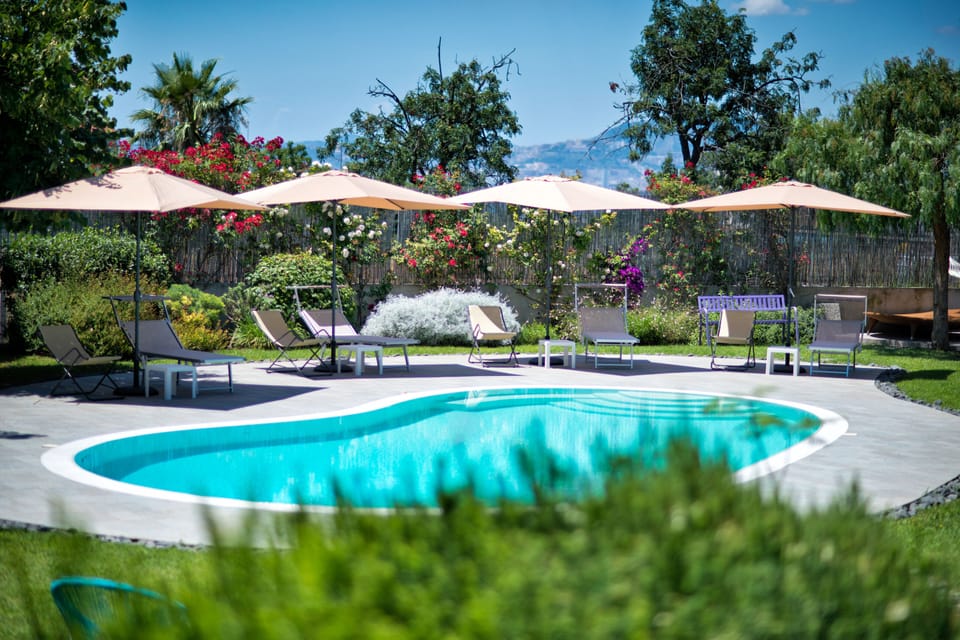 Seasonal outdoor pool, pool umbrellas, sun loungers