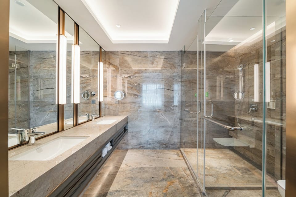 Suite, 2 Twin Beds | Bathroom | Combined shower/tub, free toiletries, hair dryer, bathrobes