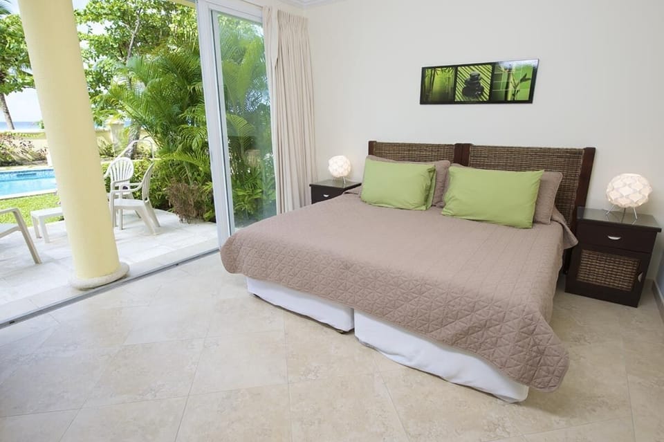 The second bedroom with pool views can also be set up as two twin beds