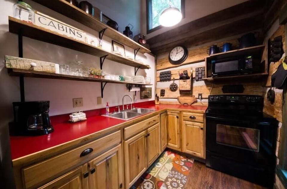 Quaint kitchen in original 1859 cabin with modern amenities