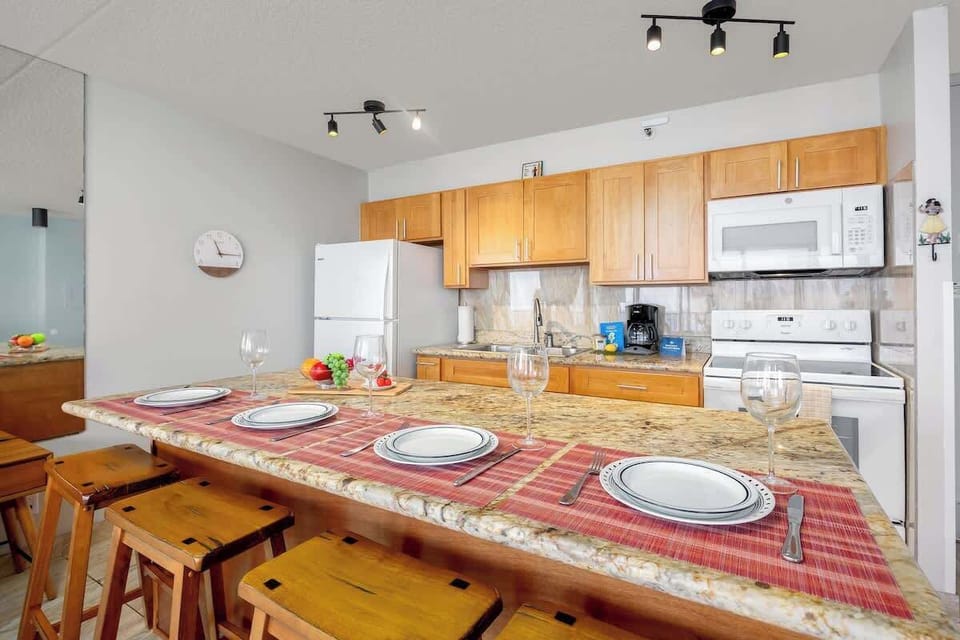 Dining area w/ warm lighting & seating for the whole group to gather.
