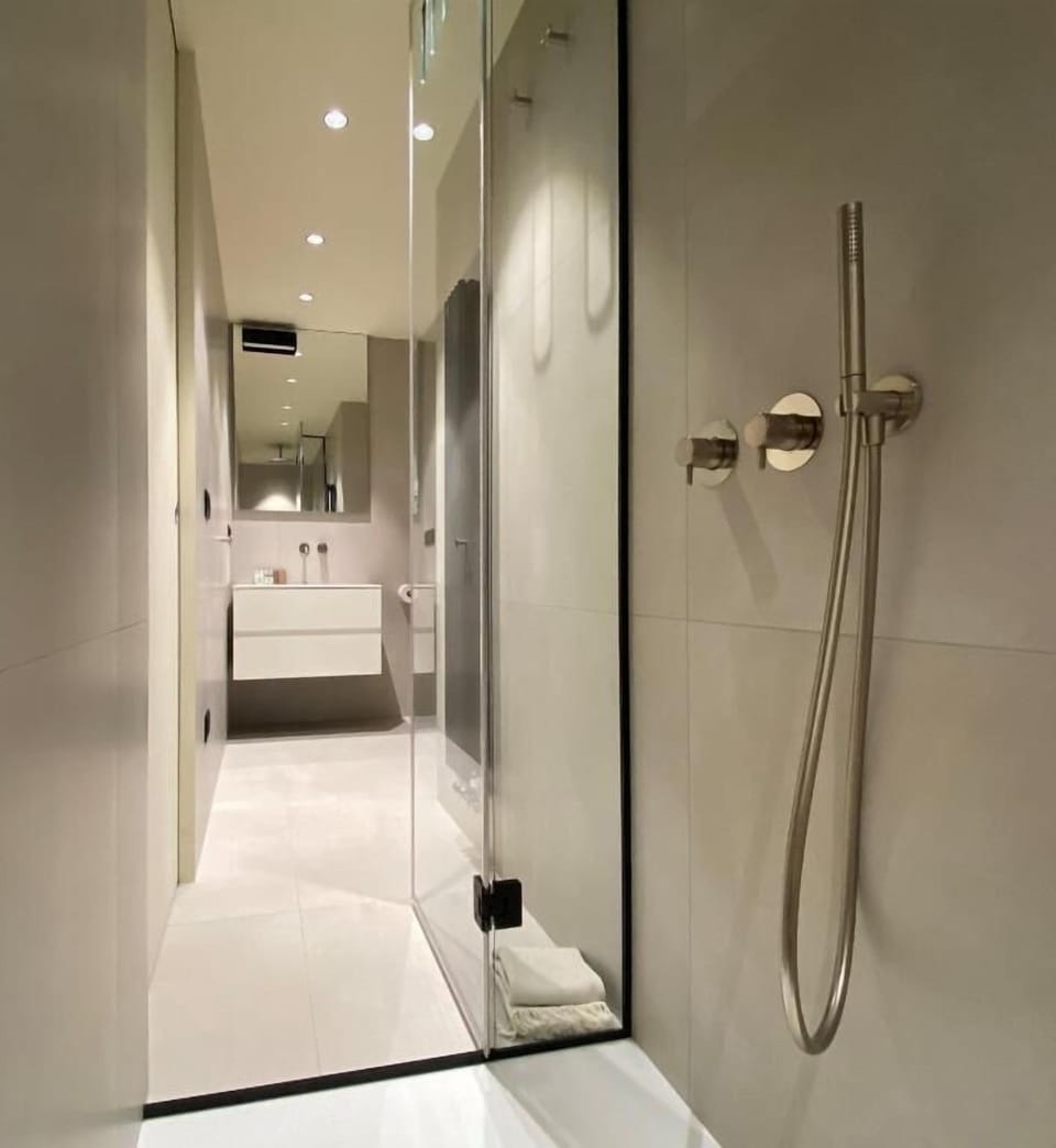 Standard Suite, 1 Bedroom, Sea View (Suite Sunset) | Bathroom | Shower, rainfall showerhead, free toiletries, hair dryer