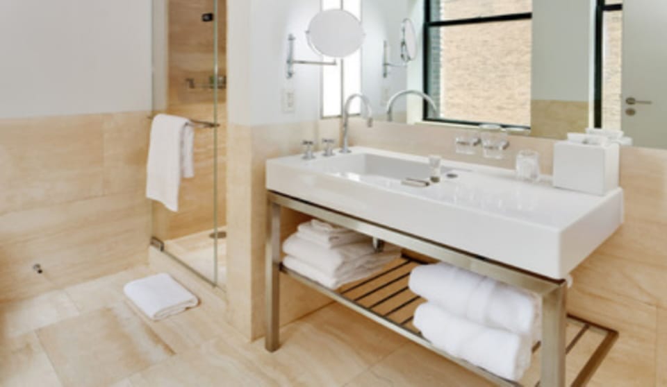 Designer toiletries, hair dryer, bathrobes, slippers
