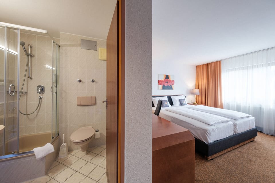 Comfort Double Room | Minibar, desk, laptop workspace, blackout drapes