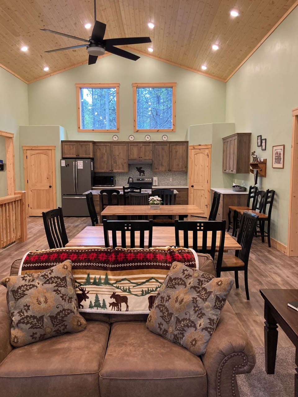 Open great room, looking from family room into dining area and kitchen. 