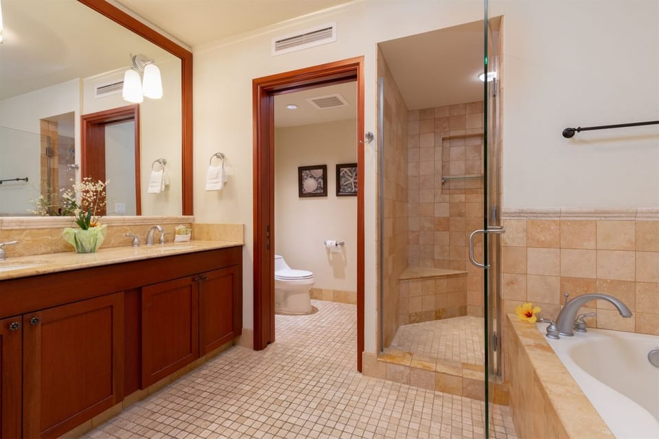 Spacious bathroom with  walk in shower and separate tub.