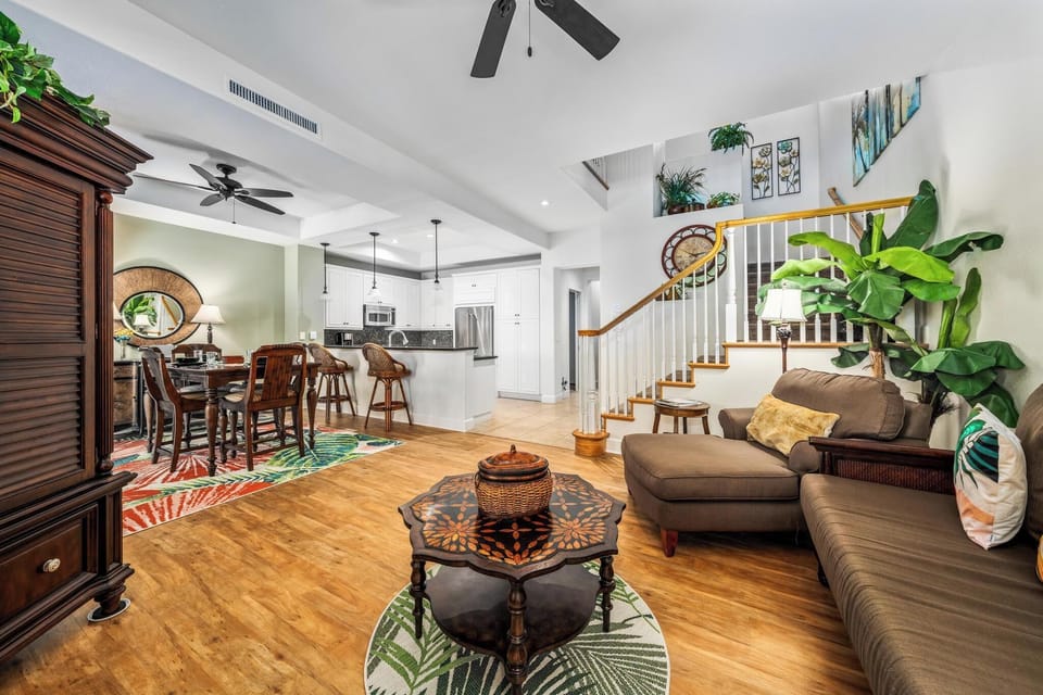 Open concept layout connects living room, dining, and kitchen